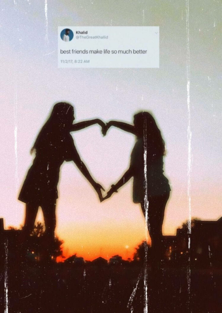Embracing the Sunset: An Unbreakable Bond between Best Friends Wallpaper