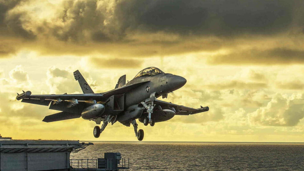 A Majestic Takeoff from the Ship Runway under a Mesmerizing Cloudy Sunset Sky Wallpaper