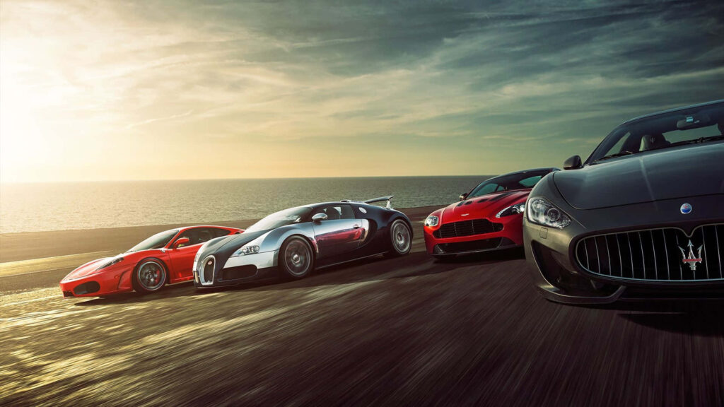 Speeding Through the Sunset: Exhilarating Drive Along the Beach - HD Car Background Wallpaper
