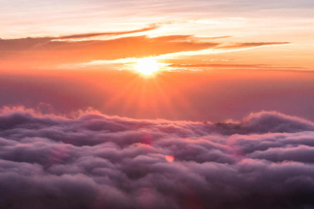 Enchanting Horizon: Majestic Sun Setting Above Exquisite Cloudscape - HD Aerial Background Wallpaper