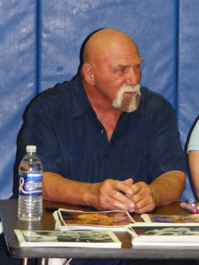 American veteran wrestler Superstar Billy Graham seated with wrestling memorabilia 2008 photo Wallpaper