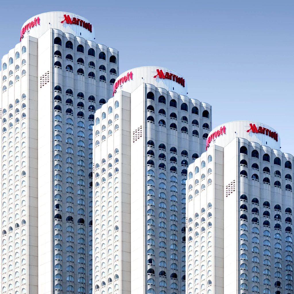 Surreal repetitive Montreal Marriott Chateau Champlain skyline with arched windows and blue sky wallpaper