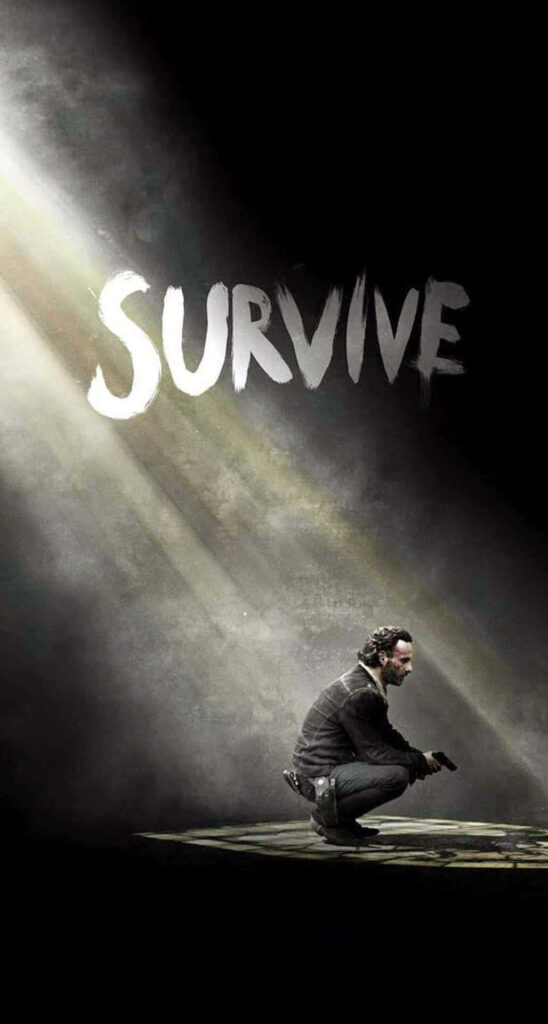 Survive: Dramatic The Walking Dead Wallpaper Emphasizing Resilience