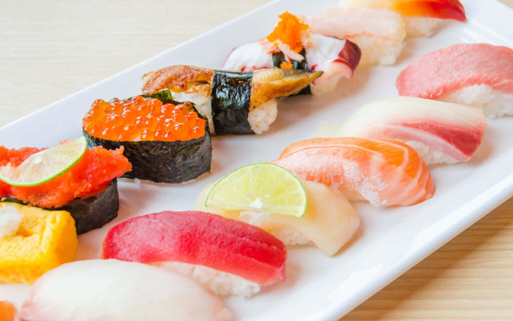 Stunning Sushi Wallpaper: Freshly Arranged with Lime Accents