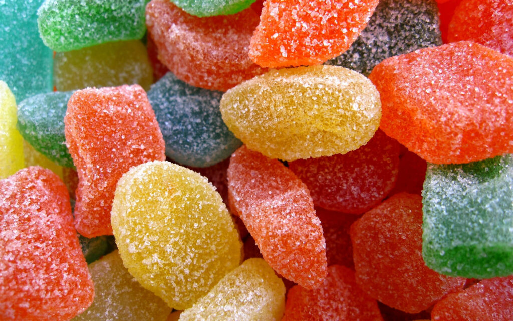 Sugary Spectacle: Vibrant Multicolored Assortment of Candy Delights Wallpaper