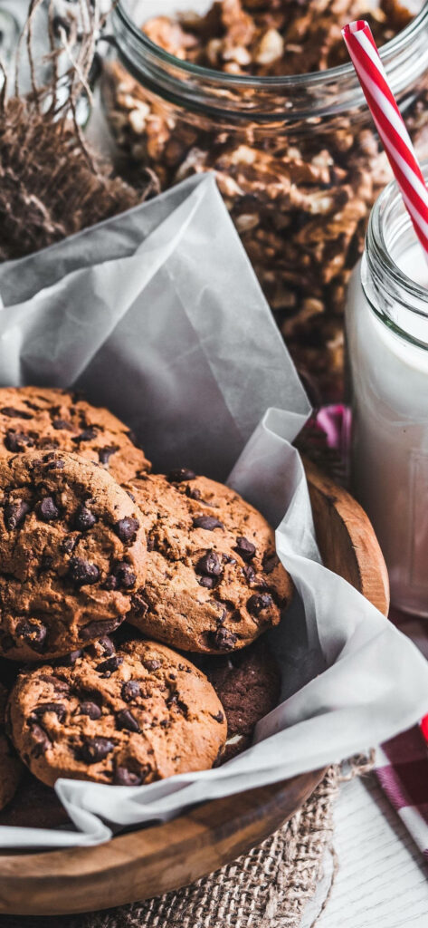 Satisfying Sweet Treat: Tempting Cookies and Milk in Rustic Presentation for iPhone Screens Wallpaper