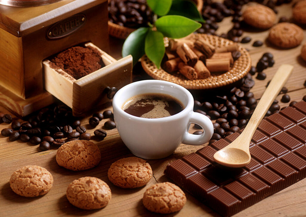 Savoring Indulgence: A Coffee and Confections Delight Wallpaper