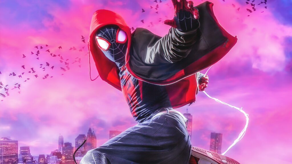 Dynamic Superhero Wallpaper with Spider-Man Inspired Character in Black Suit on Vibrant City Background - Spider-Man Miles Morales Style Image with Electric Webbing Effect and Birds in Flight.