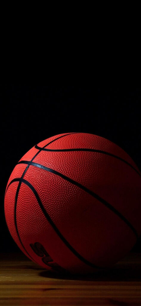 Dribbling Dreams: A Striking Basketball Showcase in this Sleek iPhone Wallpaper