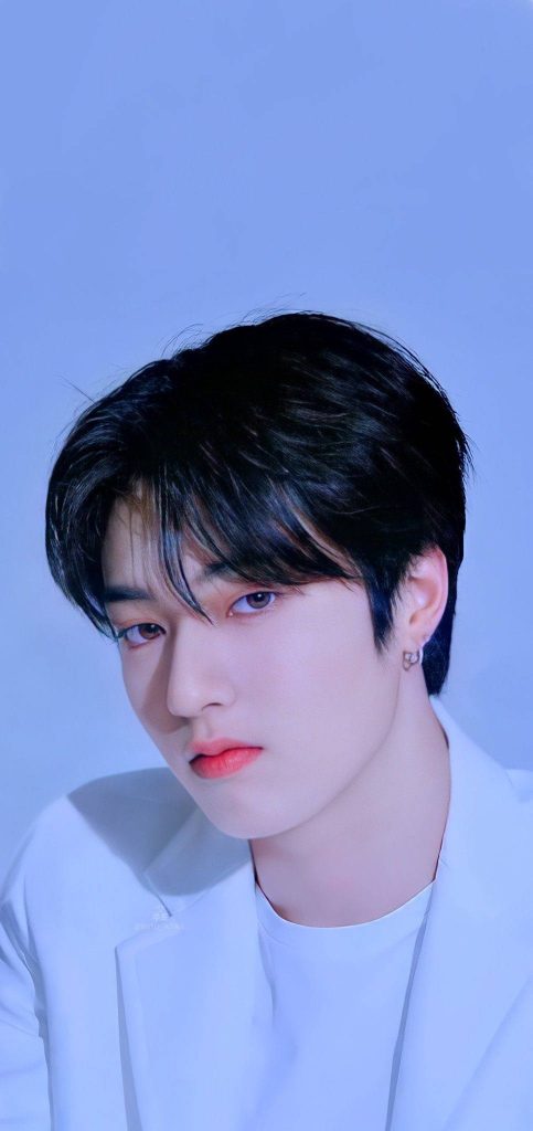 Portrait of TREASURE rapper Watanabe Haruto in white with cool blue tones stylish Kpop wallpaper