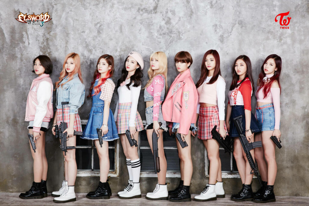 TWICE Drops the Beat and Guns for an Explosive Surprise: Live Performance Wallpaper