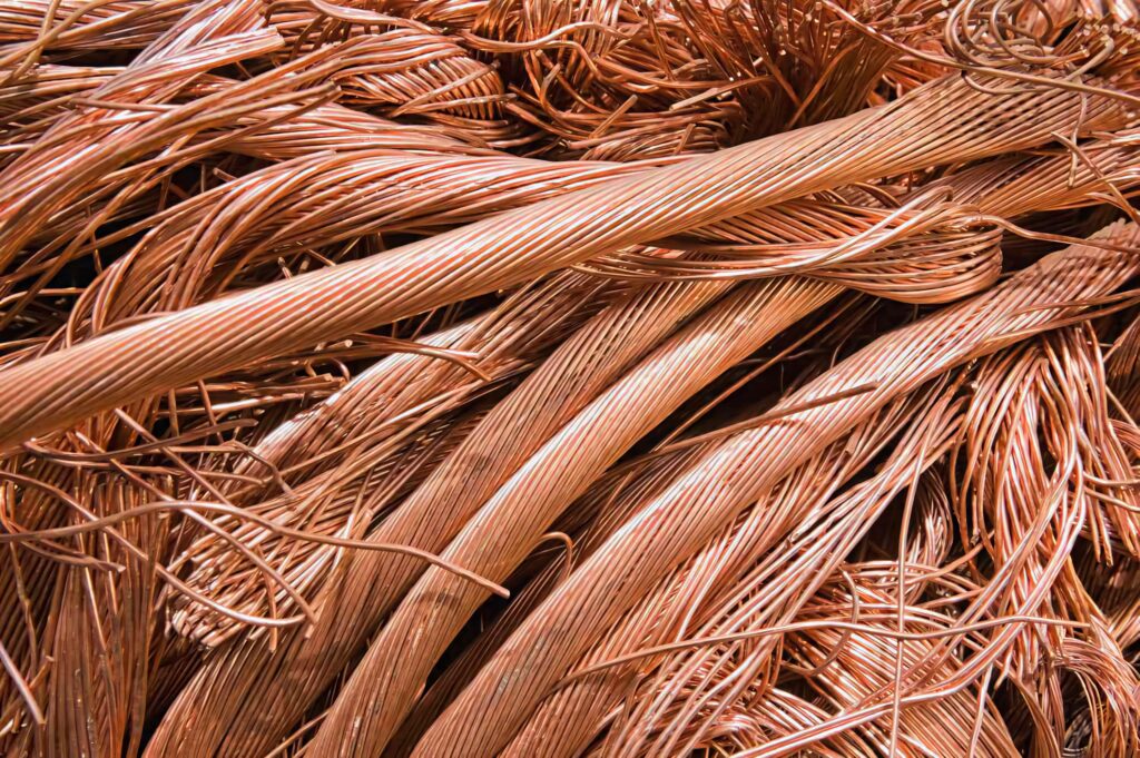Close-up of tangled copper wires showing detailed textures and warm metallic copper tones background Wallpaper