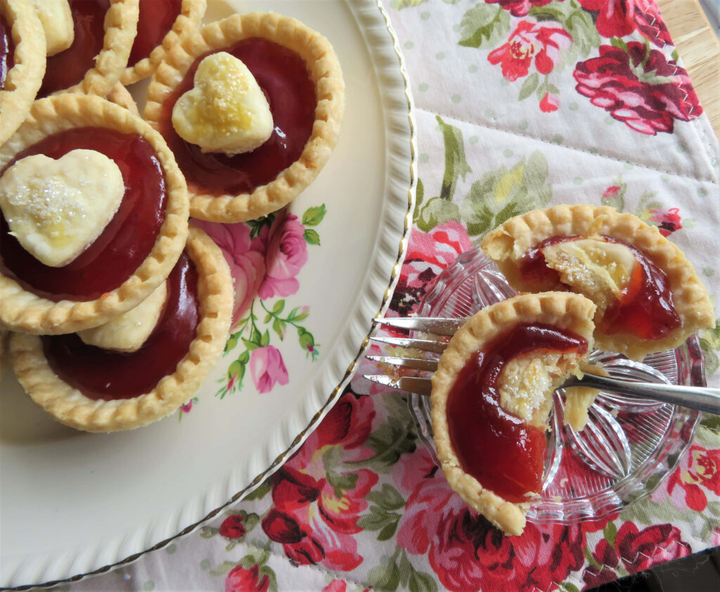 Love at First Bite: A Delicious Tart with a Heart-shaped Topping Ready to be Savored Wallpaper
