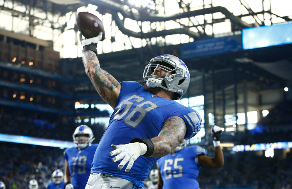 Taylor Decker Celebrates in Lions Uniform - Dynamic Wallpaper Background