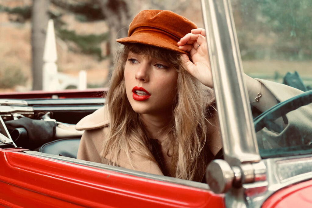 Taylor Swift in red convertible vintage Red Taylors Version album wallpaper background