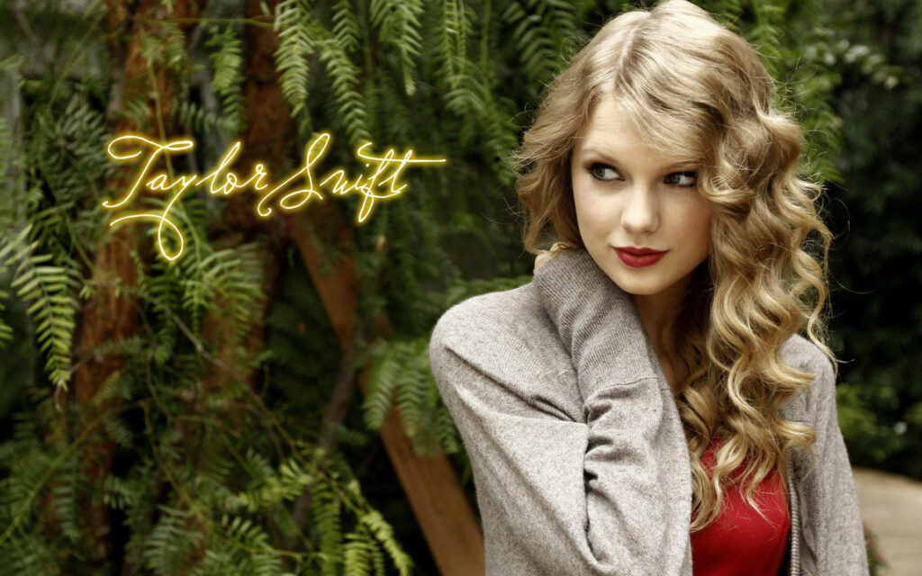 Taylor Swift Shines Onstage: Live Wallpaper of Pop Superstar's Spectacular Performance.