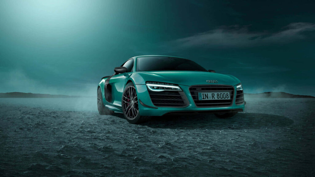 Teal blue Audi R8 on rugged dusty terrain under dramatic evening sky sleek sports car wallpaper