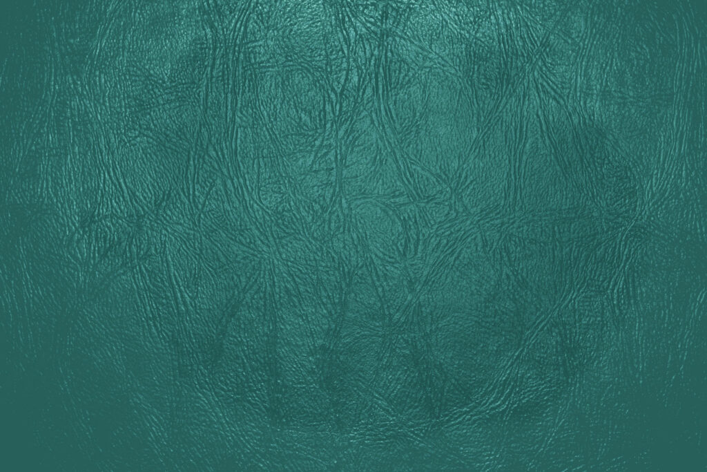 Scratched Teal Leather: A Minimalistic Wallpaper with Amazing Texture