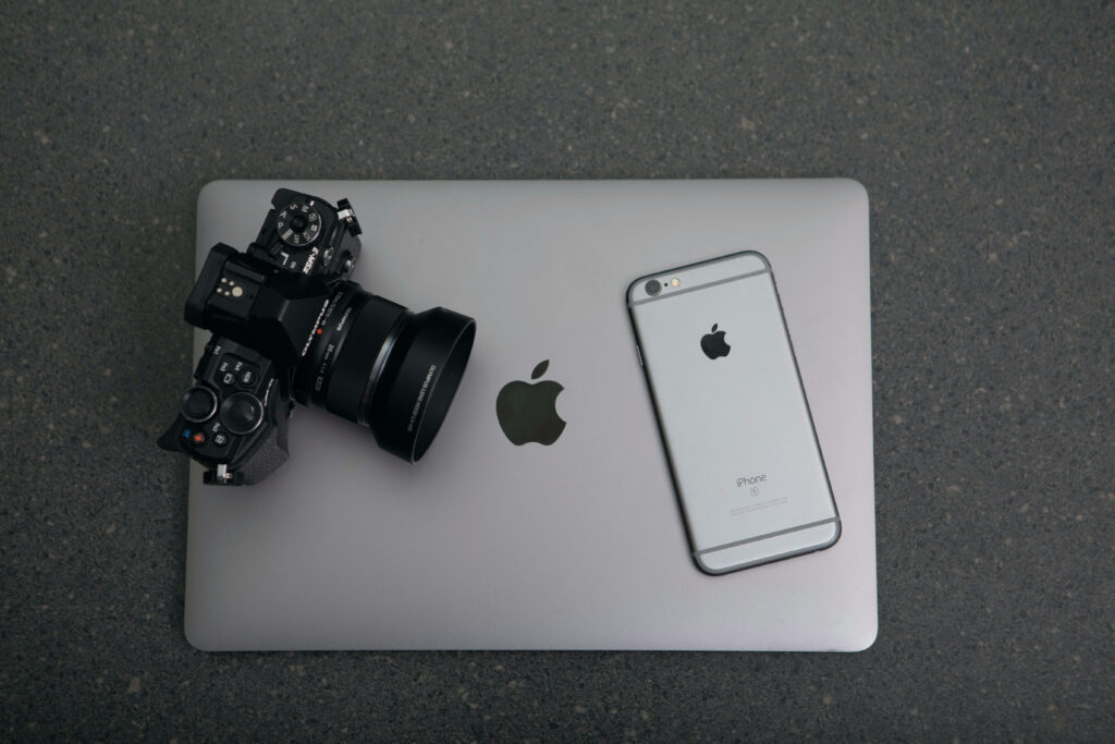 Tech Trio: Capturing Creativity on a Sleek Surface Wallpaper