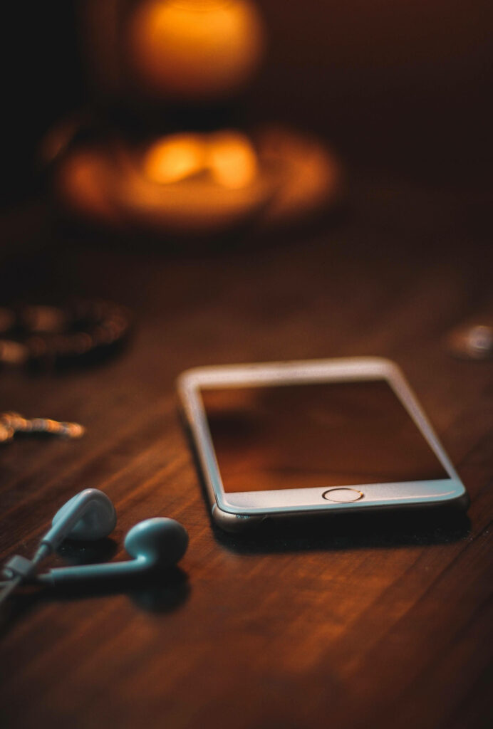Tech Vibes: Stylish Android Setup with Headphones on Table Wallpaper