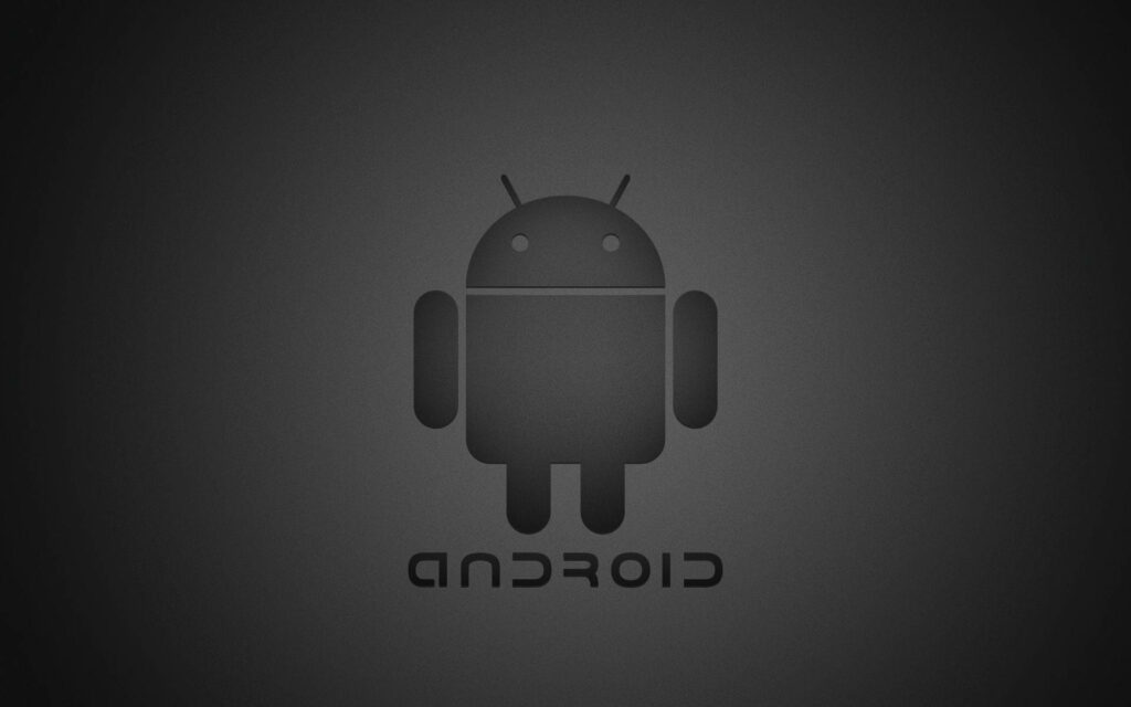 The Iconic Black Android Logo Pops Against a Sleek Gray Tablet Background Wallpaper
