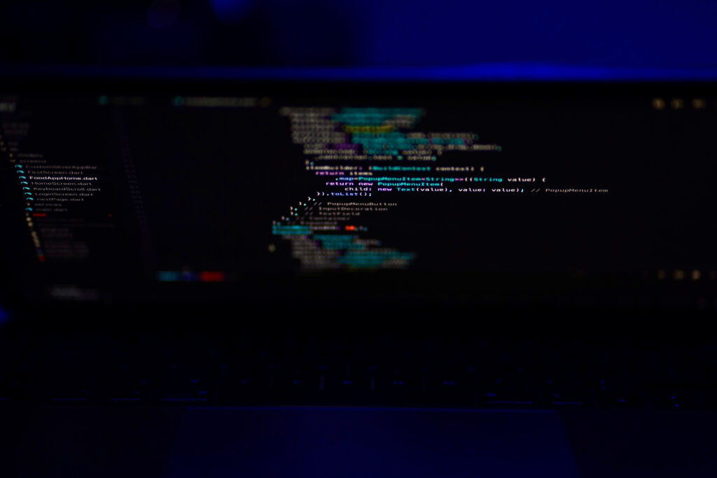 Dark-Themed Laptop Code Wallpaper for Tech Enthusiasts