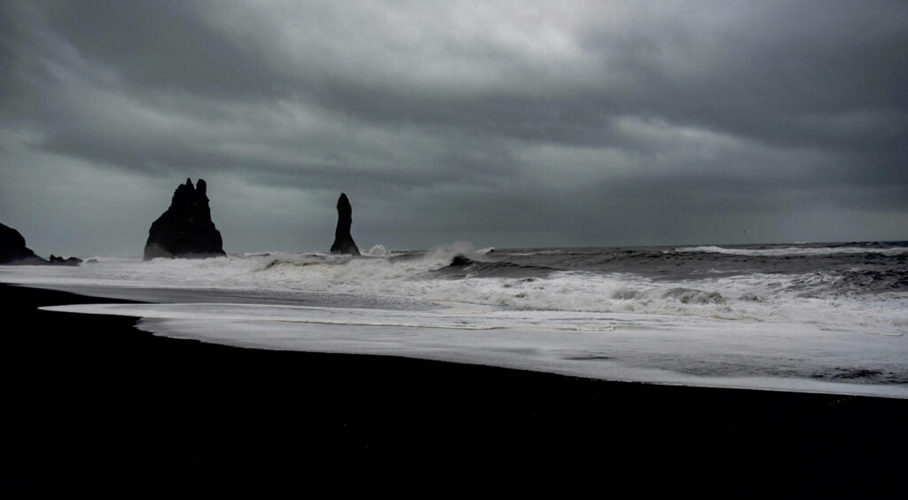 Tempestuous Waters: A brooding stormy sea dark theme wallpaper