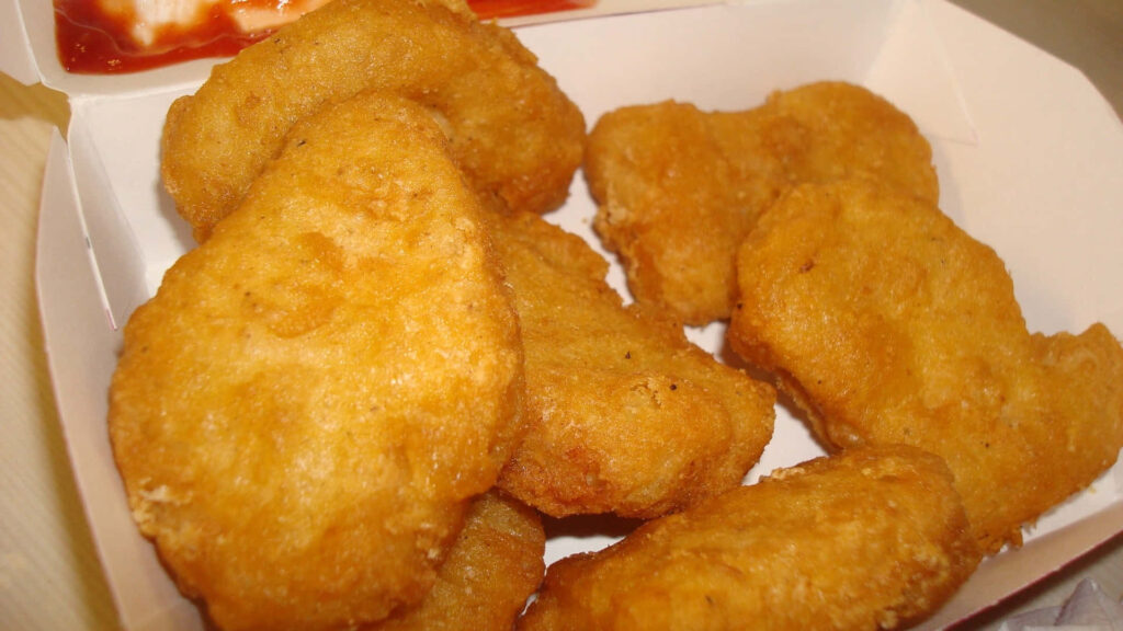 Crispy Golden Chicken Nuggets Wallpaper: Tempting Close-Up Background