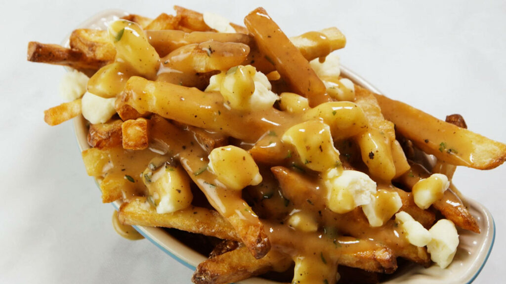 Tempting Poutine Platter: Crispy Fries, Gravy & Cheese Curds Wallpaper