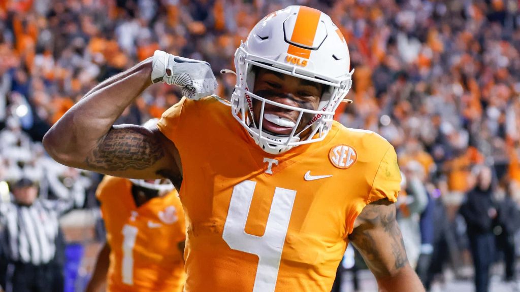 Tennessee Volunteers football player number 4 flexing in stadium captures college football intensity wallpaper