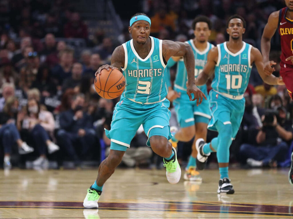 Terry Rozier driving court Charlotte Hornets teal uniform NBA game dynamic motion wallpaper