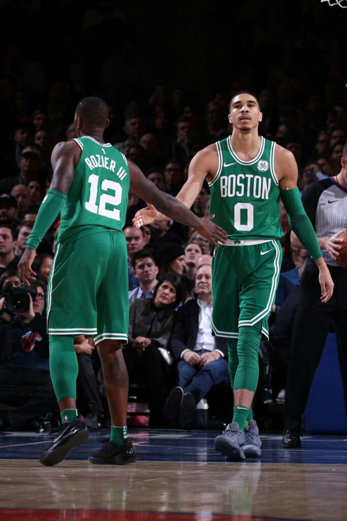 Terry Rozier and Jayson Tatum Boston Celtics handshake NBA basketball action vibrant green uniforms Wallpaper