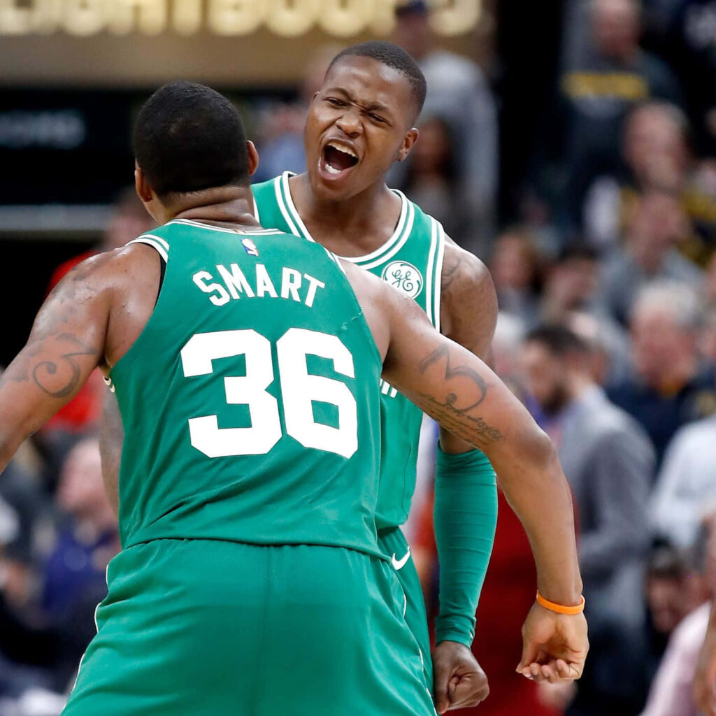 Terry Rozier and Marcus Smart celebrate in Boston Celtics green jerseys dynamic NBA basketball wallpaper