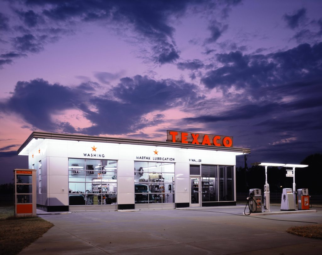 Texaco gas station wallpaper retro service bays vintage pumps telephone booth purple twilight
