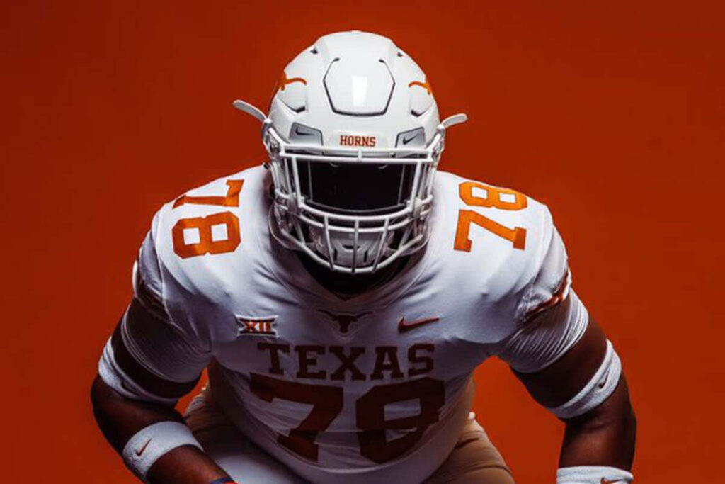 Texas Longhorns Football Player #78 in Gear on Orange Background Wallpaper