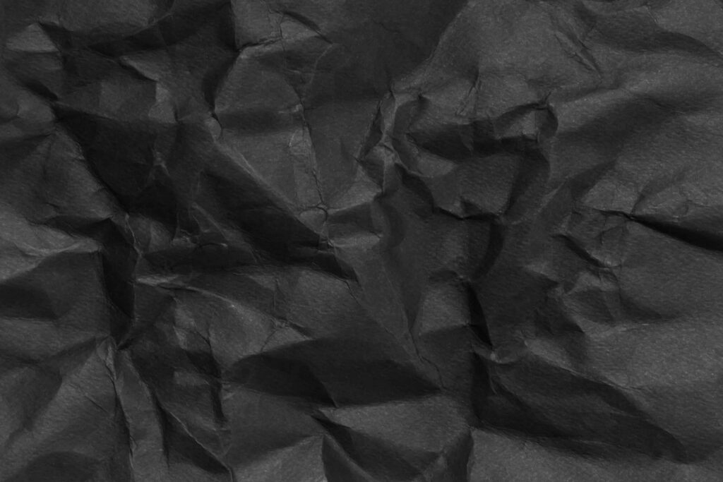 Textured Black Crumpled Paper Wallpaper for Design Projects