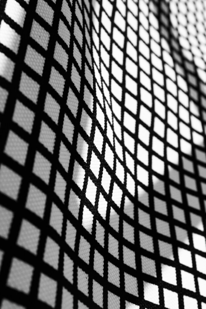 Textured Black Mesh Wallpaper: Striking Geometric Design Background