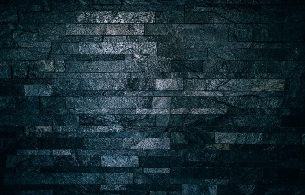 Textured Black Rock Panel Wallpaper: Sleek Modern Surface Design