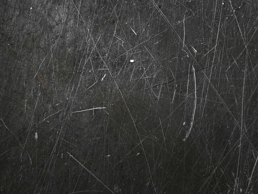 Scratched Black Textured Wallpaper: Worn Chalkboard Style Background