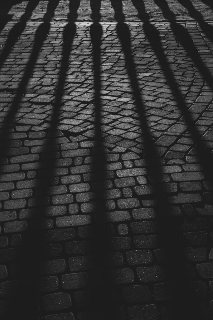 Textured Black and White Paving Stone Wallpaper with Shadow Patterns