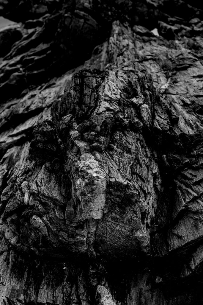 Textured Black and White Wallpaper: Rugged Rock Formation Background