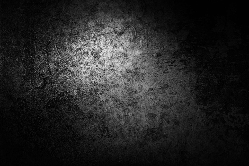 Textured Black & White Wallpaper with Central Light Contrast