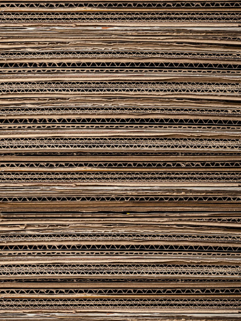 Textured Brown Cardboard Box Wallpaper with Corrugated Patterns