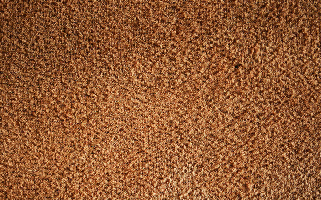 Textured Brown Fabric Close-Up: Intricate Patterns for Wallpaper