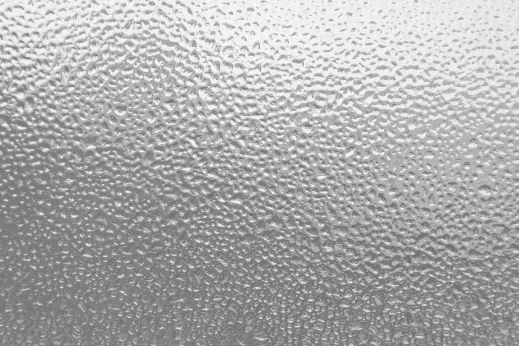 Frosted Glass Surface Wallpaper: Textured Droplets Background Image