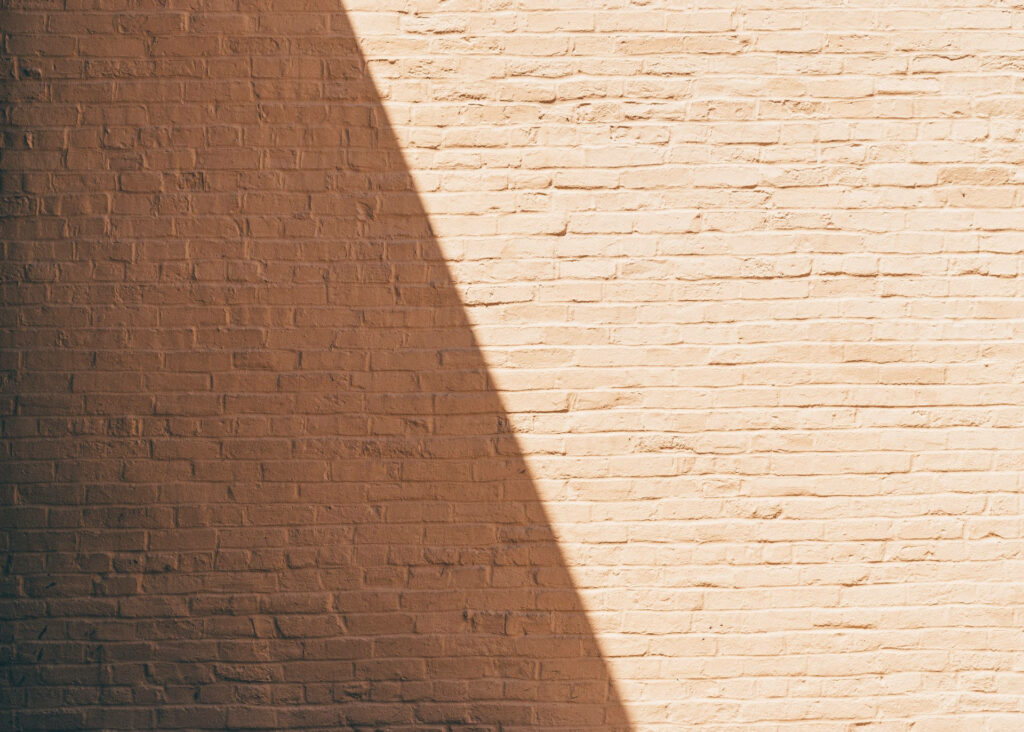 Textured Dark Brown Brick Wall Wallpaper with Rustic Depth