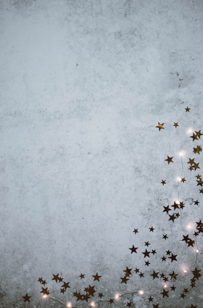 Denim Textured Background with Glittering Stars and String Lights Wallpaper