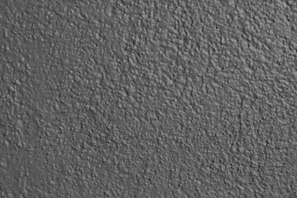 Intricate Gray Textured Wall: Ideal Wallpaper for Minimalist Designs