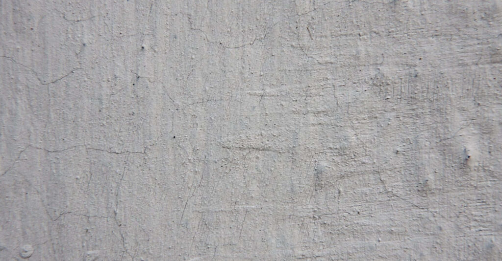 Raw Textured Gray Wall Wallpaper: Cracked, Rugged Aesthetic Background