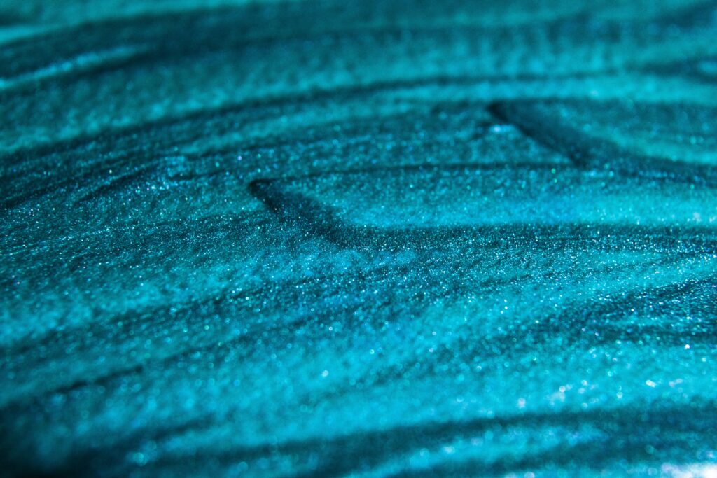 Textured Grungy Turquoise Wallpaper Background with Macro Details